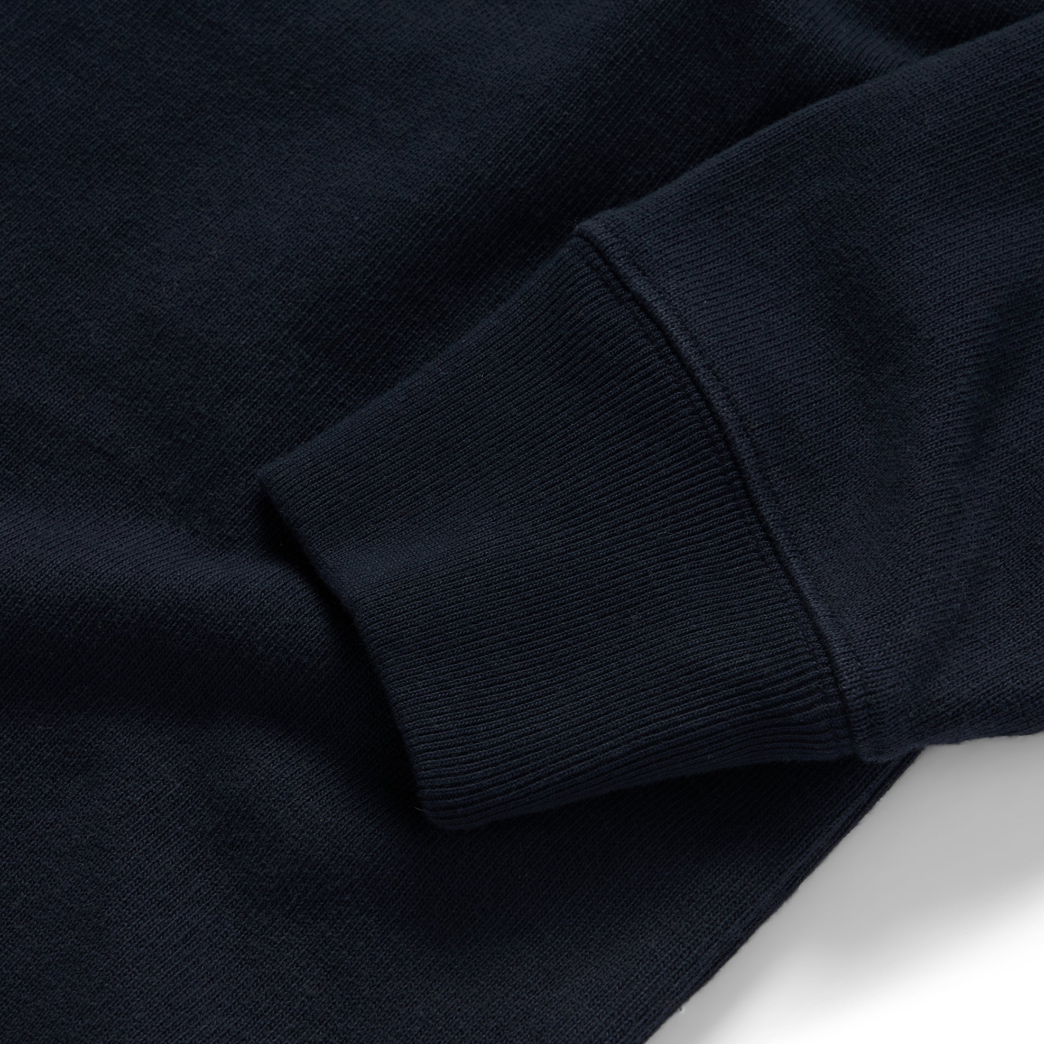 material shot of the ribbed cuffs on The Rugby Shirt in Dark Navy, Knits by Taylor Stitch