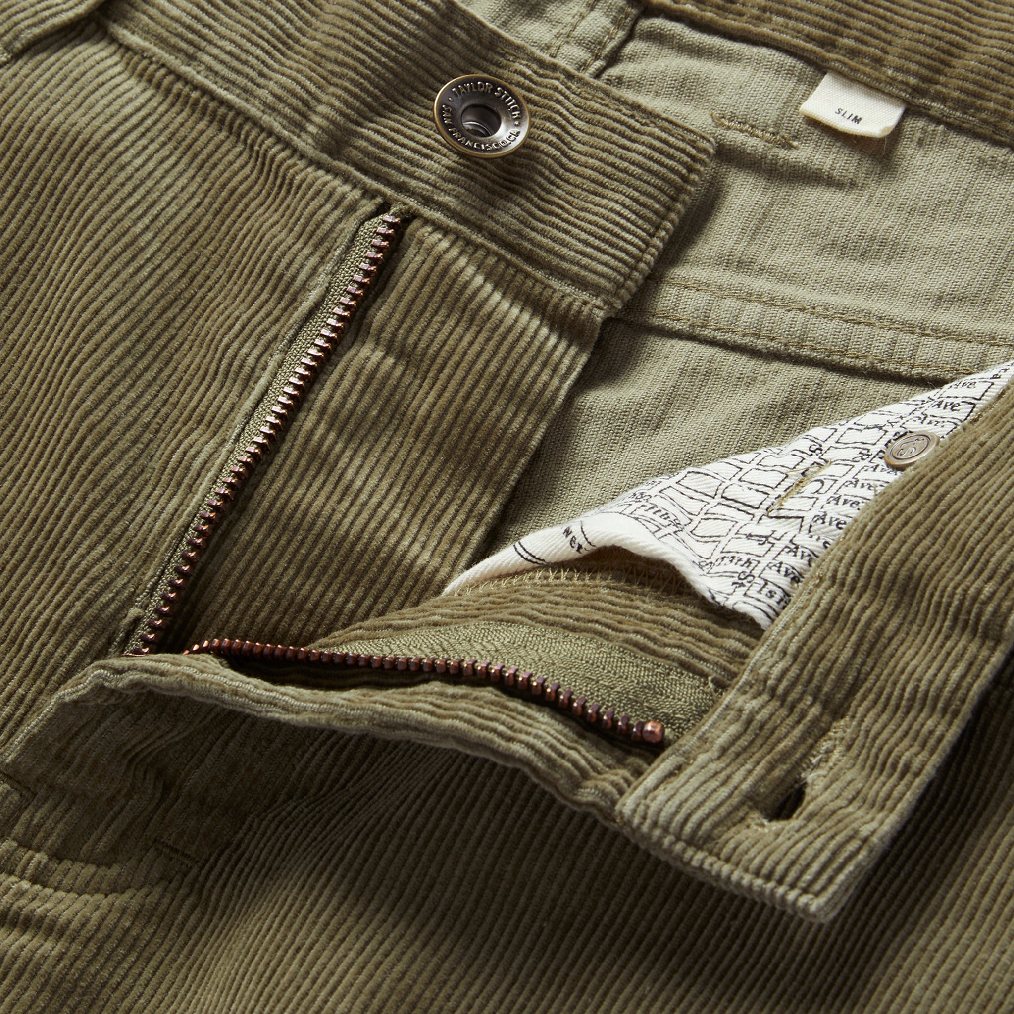 material shot of the zip fly on The Slim All Day Pant in Cypress Cord, Bottoms by Taylor Stitch