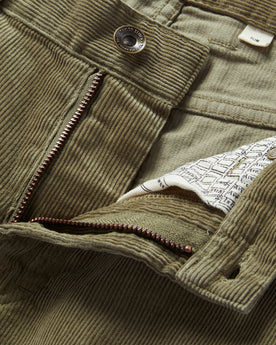 material shot of the zip fly on The Slim All Day Pant in Cypress Cord, Bottoms by Taylor Stitch