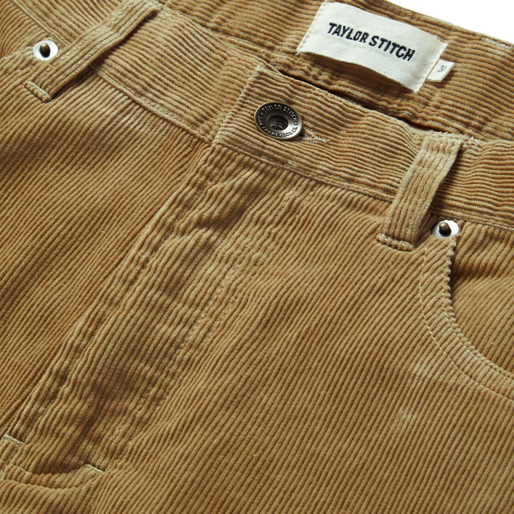material shot of the button closure on The Slim All Day Pant in Khaki Cord, Bottoms by Taylor Stitch