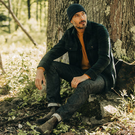 fit model sitting in The Slim Jean in Umeda Selvage