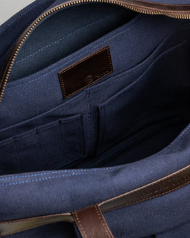 material shot of the internal pockets and pen holder compartments of The Utility Bag in Navy, Accessories by Taylor Stitch