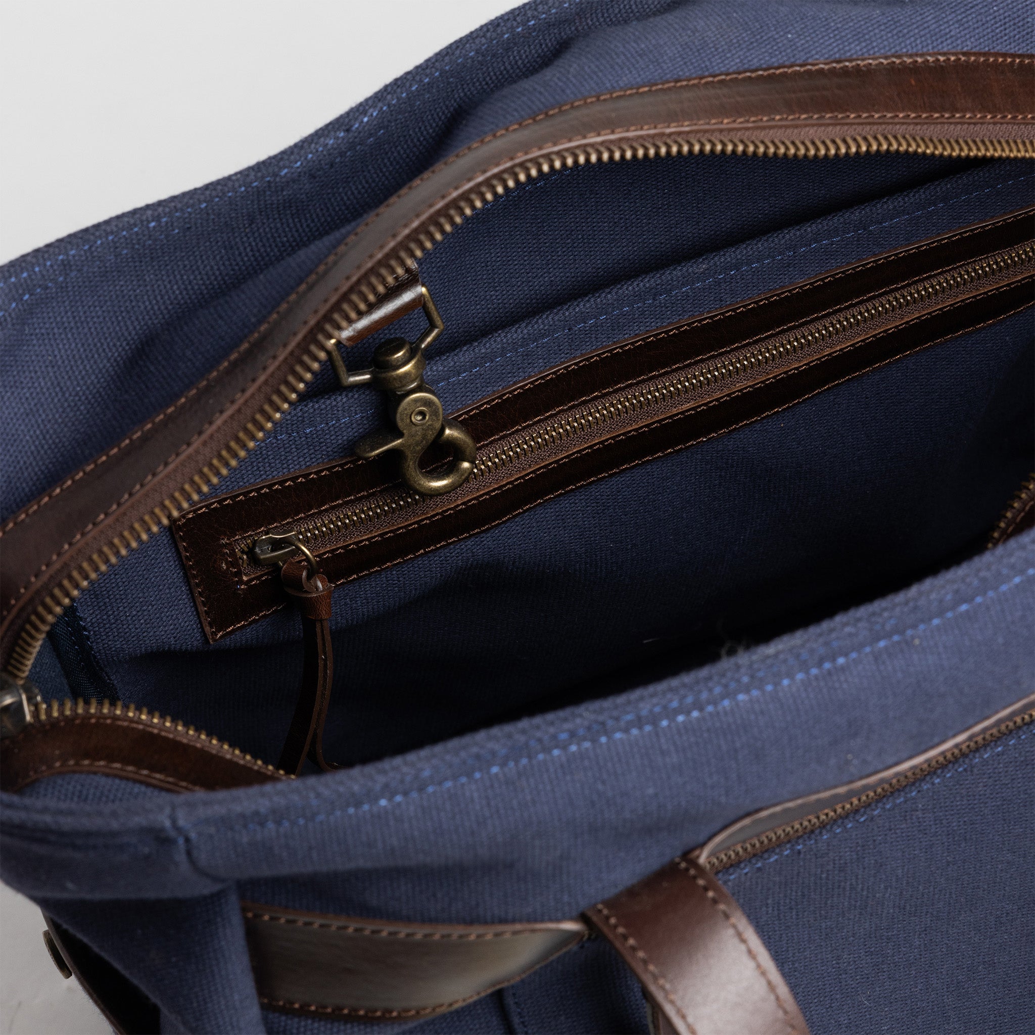 material shot of the interior zipper pocket of The Utility Bag in Navy, Accessories by Taylor Stitch