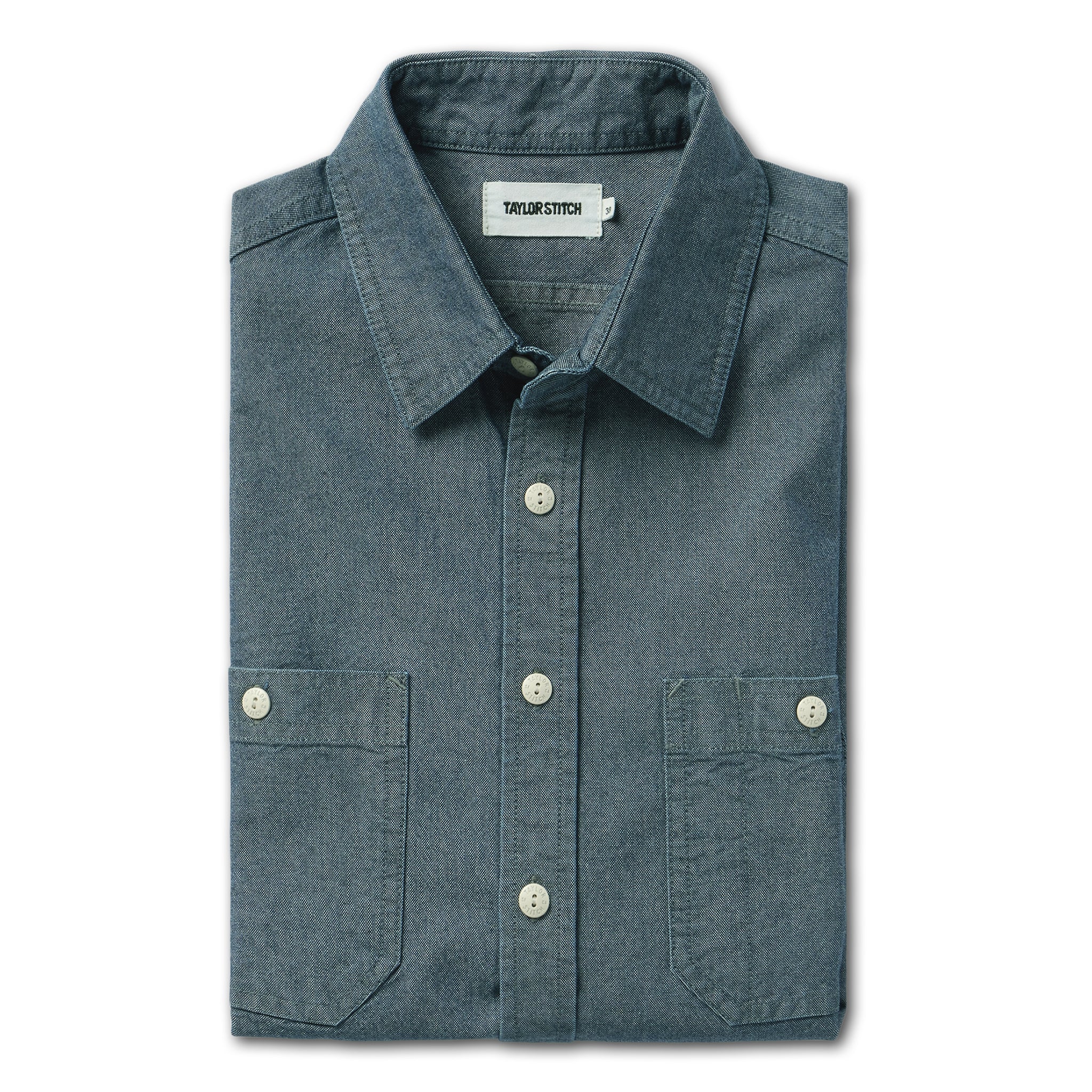 flatlay of The Utility Shirt in Rinsed Selvage Chambray folded, Wovens by Taylor Stitch