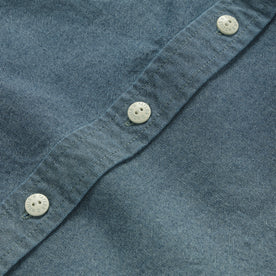 material shot of the buttons on The Utility Shirt in Rinsed Selvage Chambray