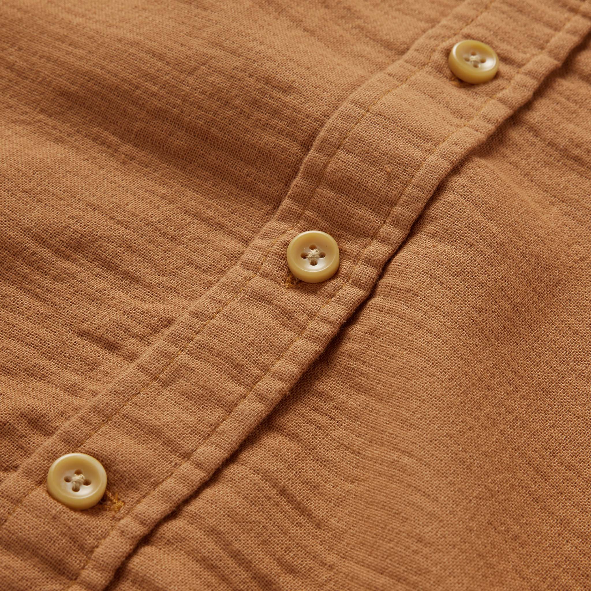material shot of the buttons on The Utility Shirt in Russet Double Cloth, Wovens by Taylor Stitch