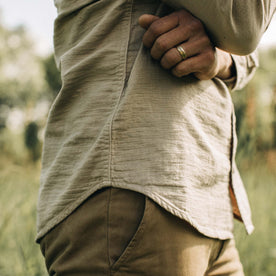 fit model showing the side of The Utility Shirt in Stone Double Cloth