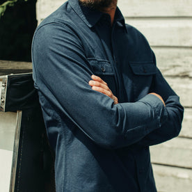 fit model with his arms folded wearing The Yosemite in Prussian Blue