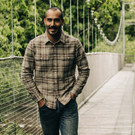 fit model walking in The Ledge Shirt in Fossil Plaid