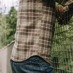 fit model showing off The Ledge Shirt in Fossil Plaid