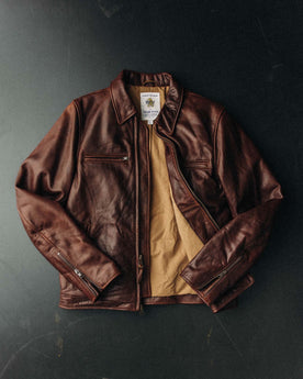 fit model sitting in The Moto Jacket in Espresso Steerhide, Outerwear by Taylor Stitch