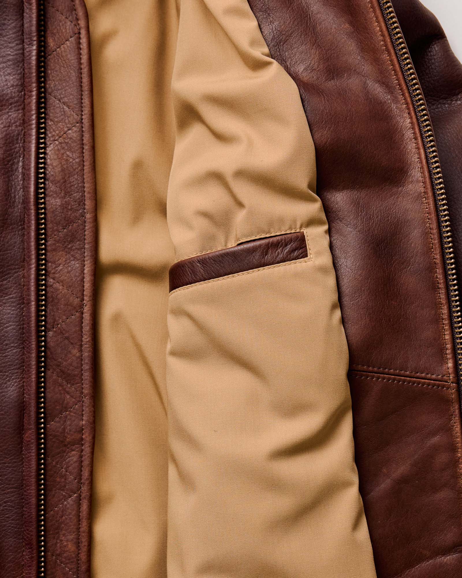 material shot of the zipper on The Moto Jacket in Espresso Steerhide, Outerwear by Taylor Stitch