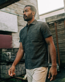 fit mdoel walking outside in The Short Sleeve Hawthorne in Navy Wave, Wovens by Taylor Stitch