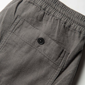 material shot of back pocket of The Apres Pant in Charcoal Double Cloth