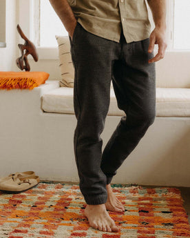 fit model wearing The Apres Pant in Charcoal Sashiko, hands in pockets, Bottoms by Taylor Stitch