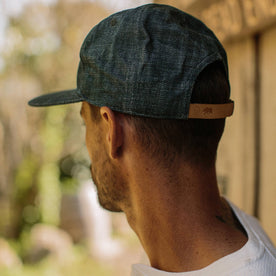 fit model wearing The Ball Cap in Organic Denim from the back