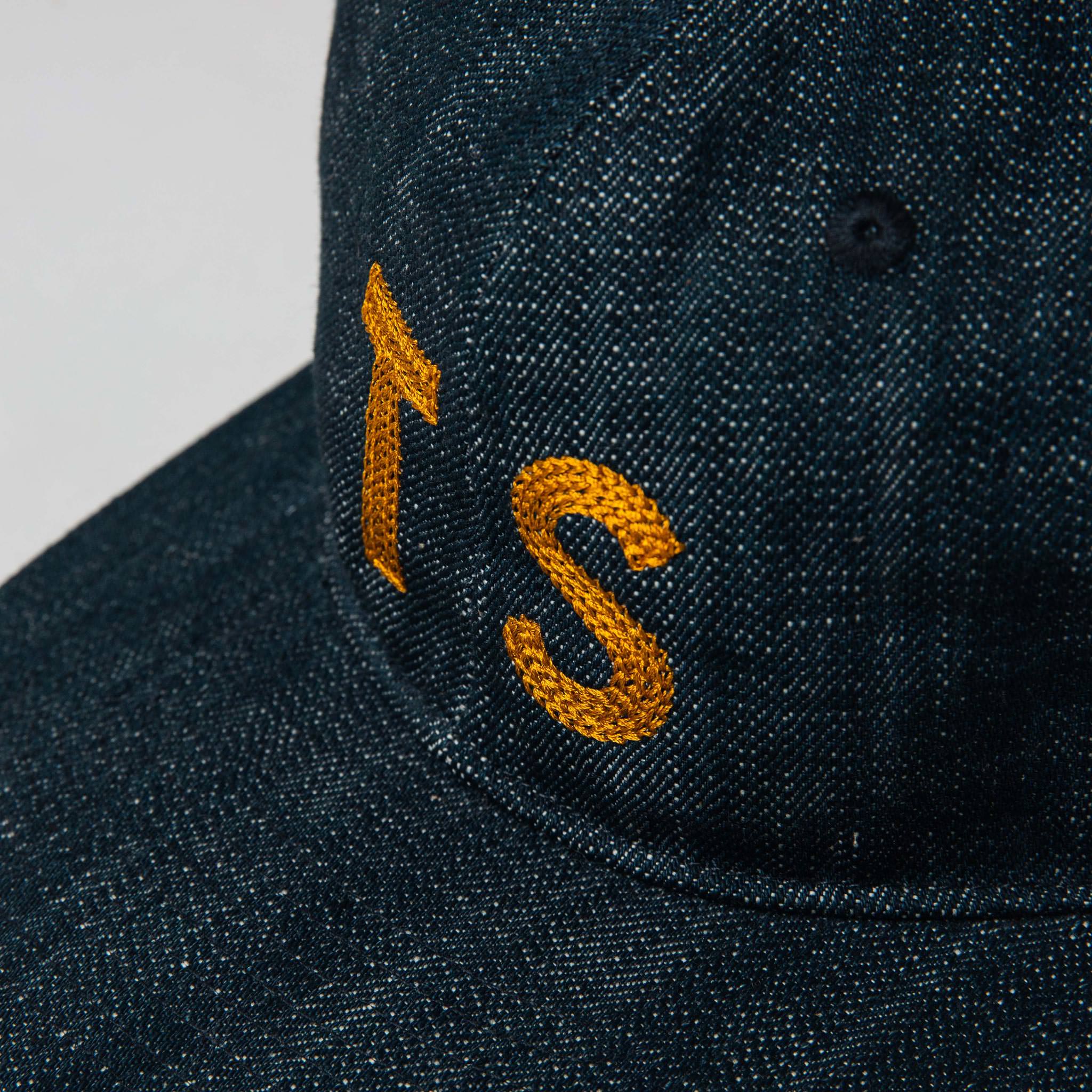 material shot of The Ball Cap in Organic Denim showing TS, Accessories by Taylor Stitch