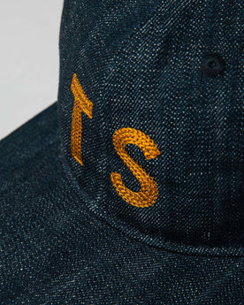 material shot of The Ball Cap in Organic Denim showing TS, Accessories by Taylor Stitch