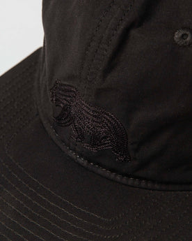 material shot of The Ball Cap in Espresso Dry Wax showing bear, Accessories by Taylor Stitch