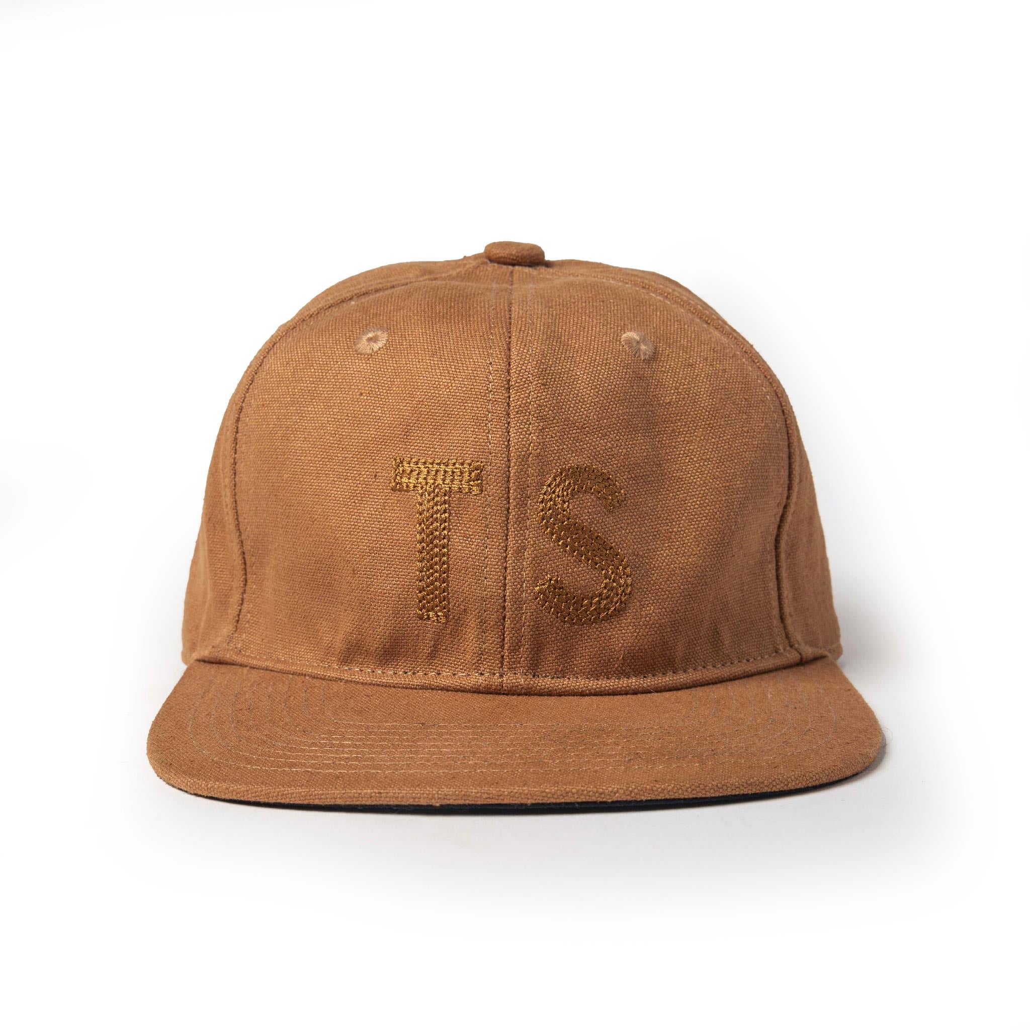 flatlay of The Ball Cap in Tobacco Boss Duck, Accessories by Taylor Stitch