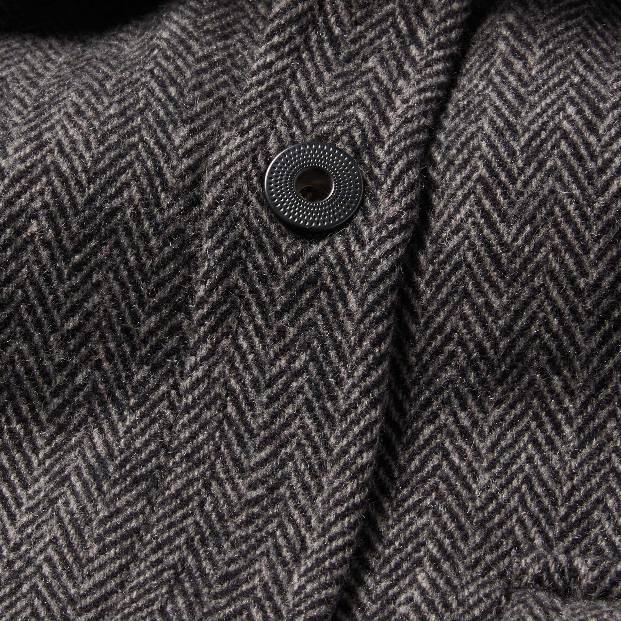 material shot of The Explorer Shirt in Coal Herringbone Wool showing front placket and button design, Wovens by Taylor Stitch