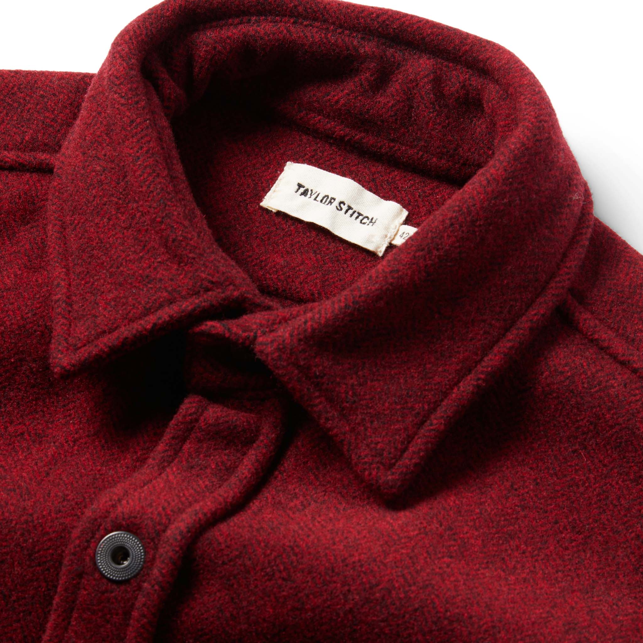 material shot of The Explorer Shirt in Burgundy Herringbone Wool showing interior label, Wovens by Taylor Stitch