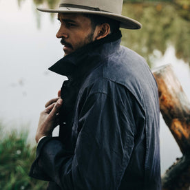 fit model with collar popped of The Field Jacket in Midnight