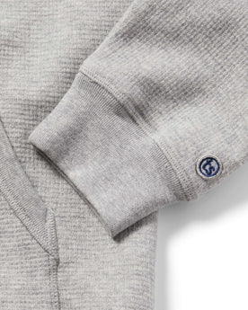 material shot of The Fillmore Hoodie in Ash Double Knit showing cuff embroidery, Knits by Taylor Stitch