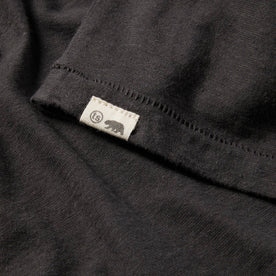 material shot of The Cotton Hemp Tee in Flower Power showing the sewn in front tag