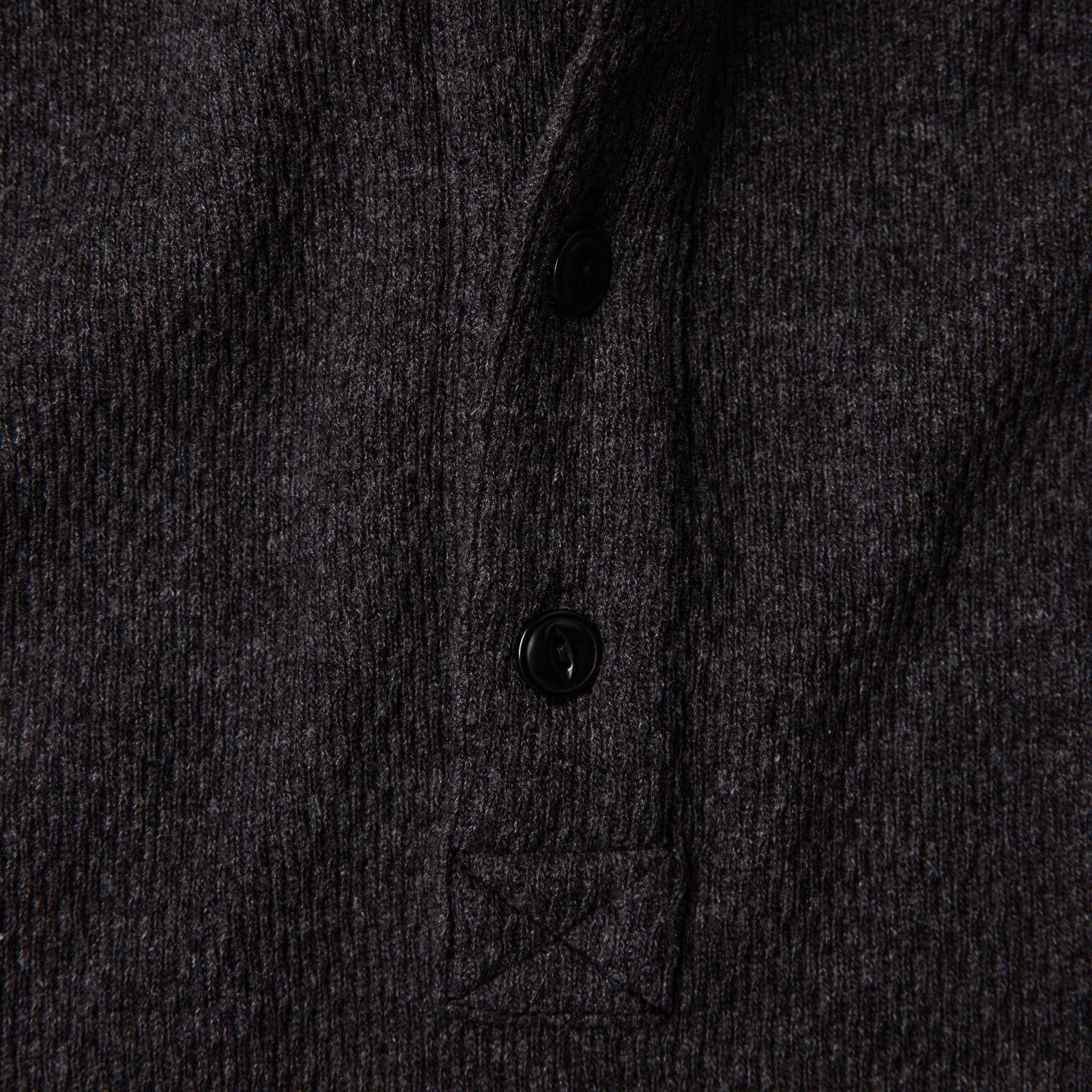 material shot of front placket of The Heavy Bag Waffle Henley in Coal, Knits by Taylor Stitch