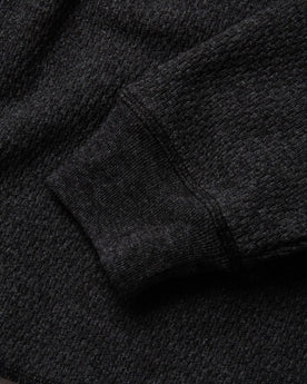 material shot of sleeve cuff of The Heavy Bag Waffle Henley in Coal, Knits by Taylor Stitch
