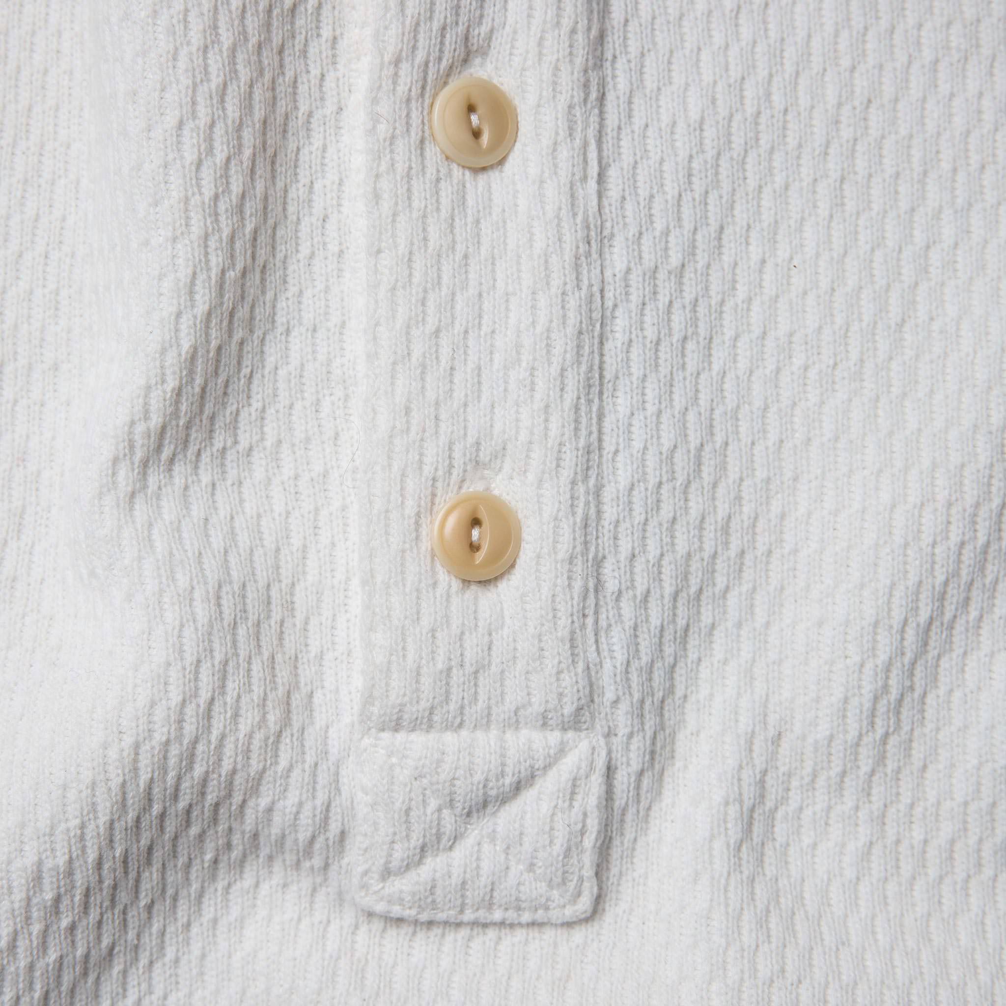 material shot of the placket of The Heavy Bag Waffle Henley in Natural, Knits by Taylor Stitch