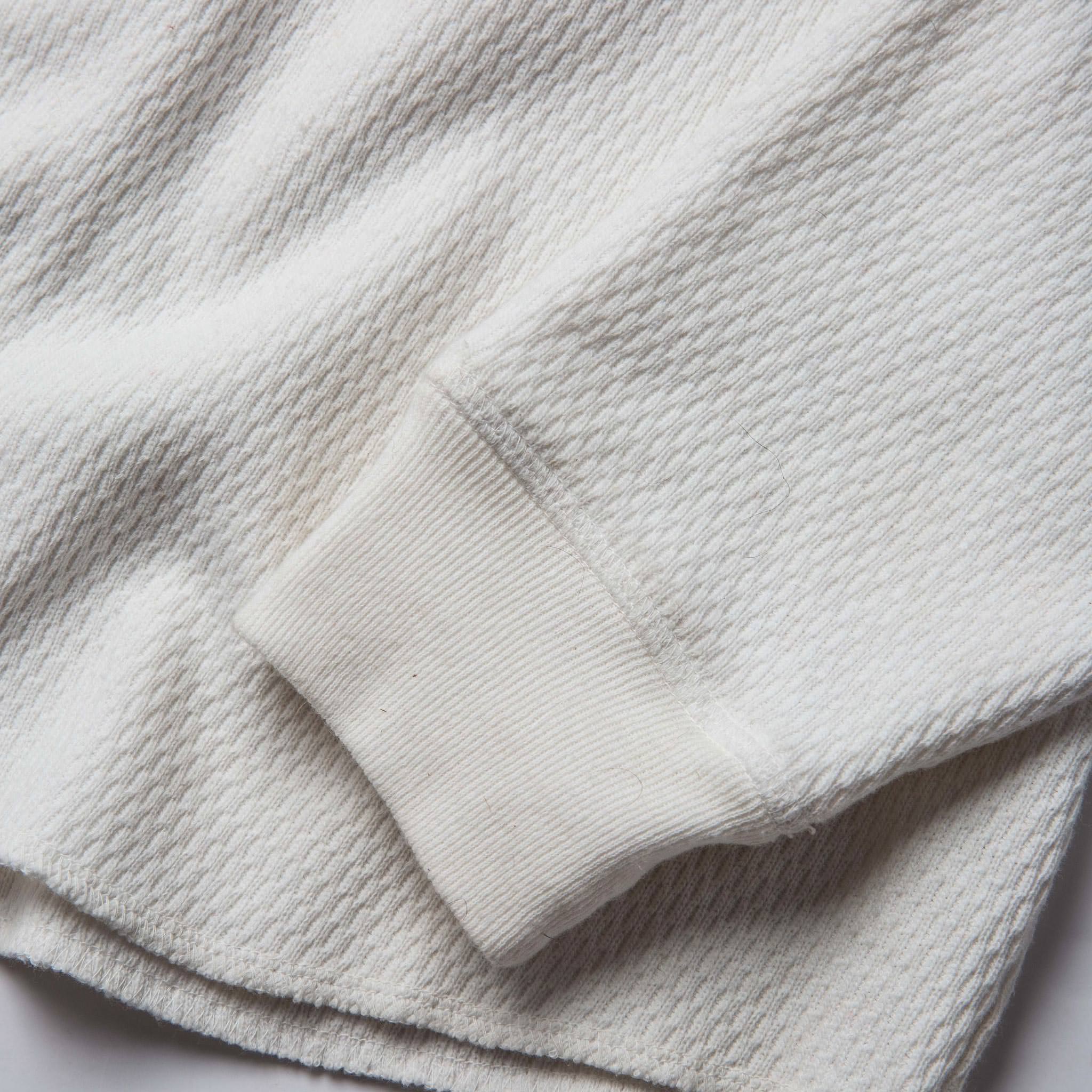 material shot of the sleeve cuff of The Heavy Bag Waffle Henley in Natural, Knits by Taylor Stitch