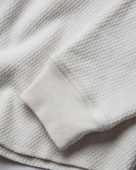 material shot of the sleeve cuff of The Heavy Bag Waffle Henley in Natural, Knits by Taylor Stitch