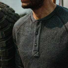 fit model showing close up of chest placket in The Heavy Bag Waffle Henley in Navy