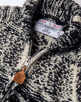 material shot of The Seawall Hand-knit Sweater showing the interior collaboration label, Knits by Taylor Stitch