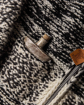 material shot of The Seawall Hand-knit Sweater with a flask in the exterior pocket, Knits by Taylor Stitch