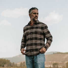 fit model wearing The Ledge Shirt in Espresso Plaid, looking right