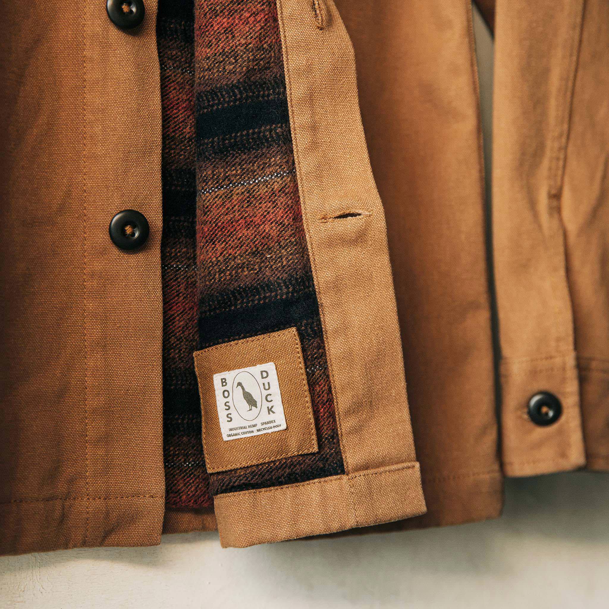 material shot of boss duck logo, Outerwear by Taylor Stitch