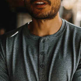 fit model wearing The Merino Henley, chest detail