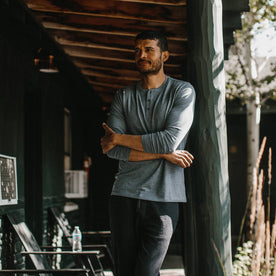 fit model wearing The Merino Henley, looking left outside