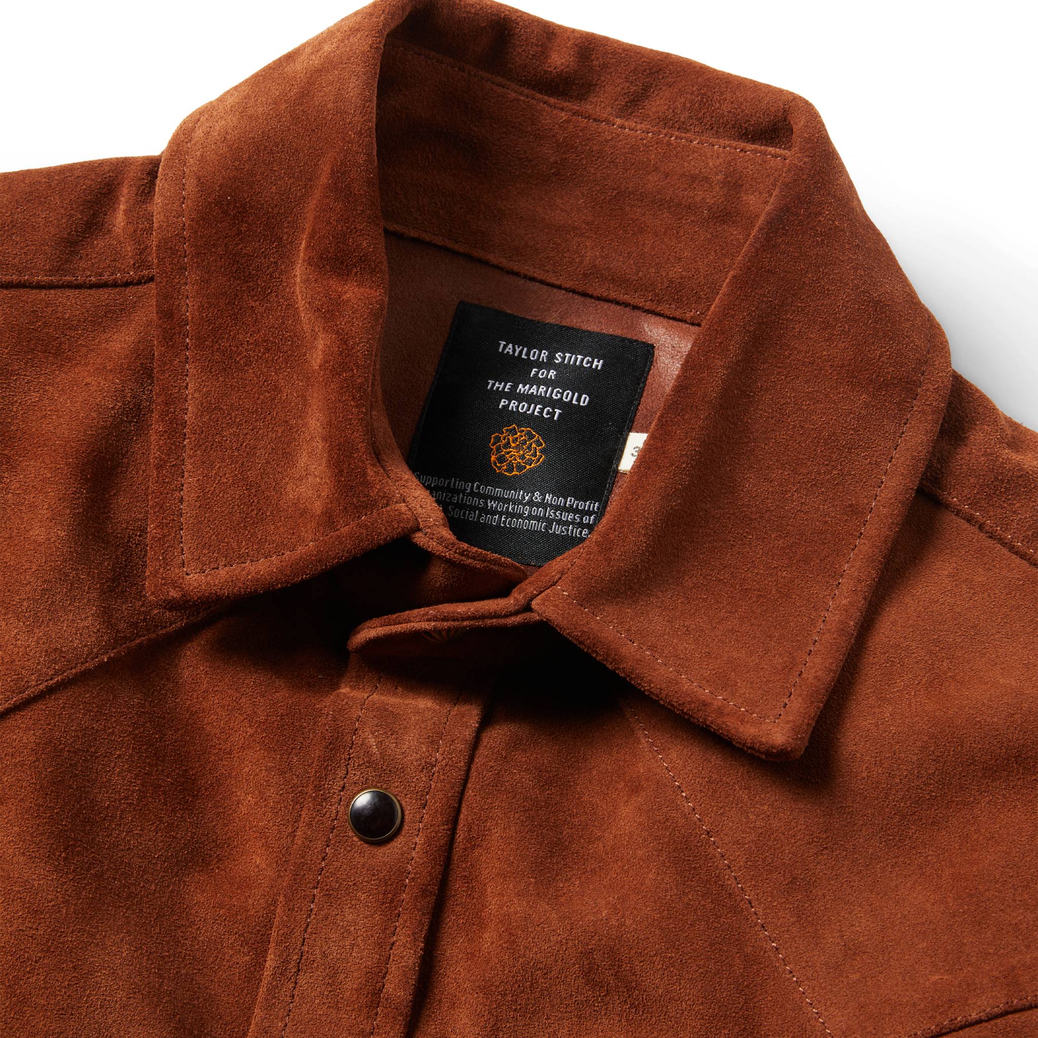 material shot of The Western Shirt in Espresso Suede showing interior tag, Outerwear by Taylor Stitch