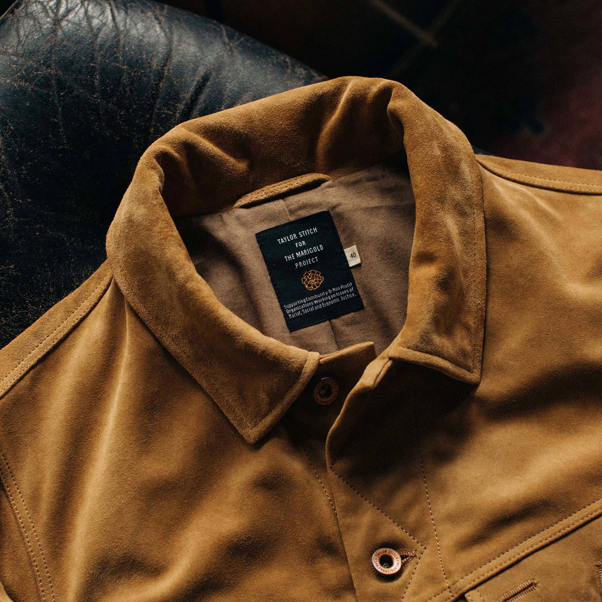 material shot showing collaboration tag on The Lined Long Haul Jacket in Sand Suede, Outerwear by Taylor Stitch