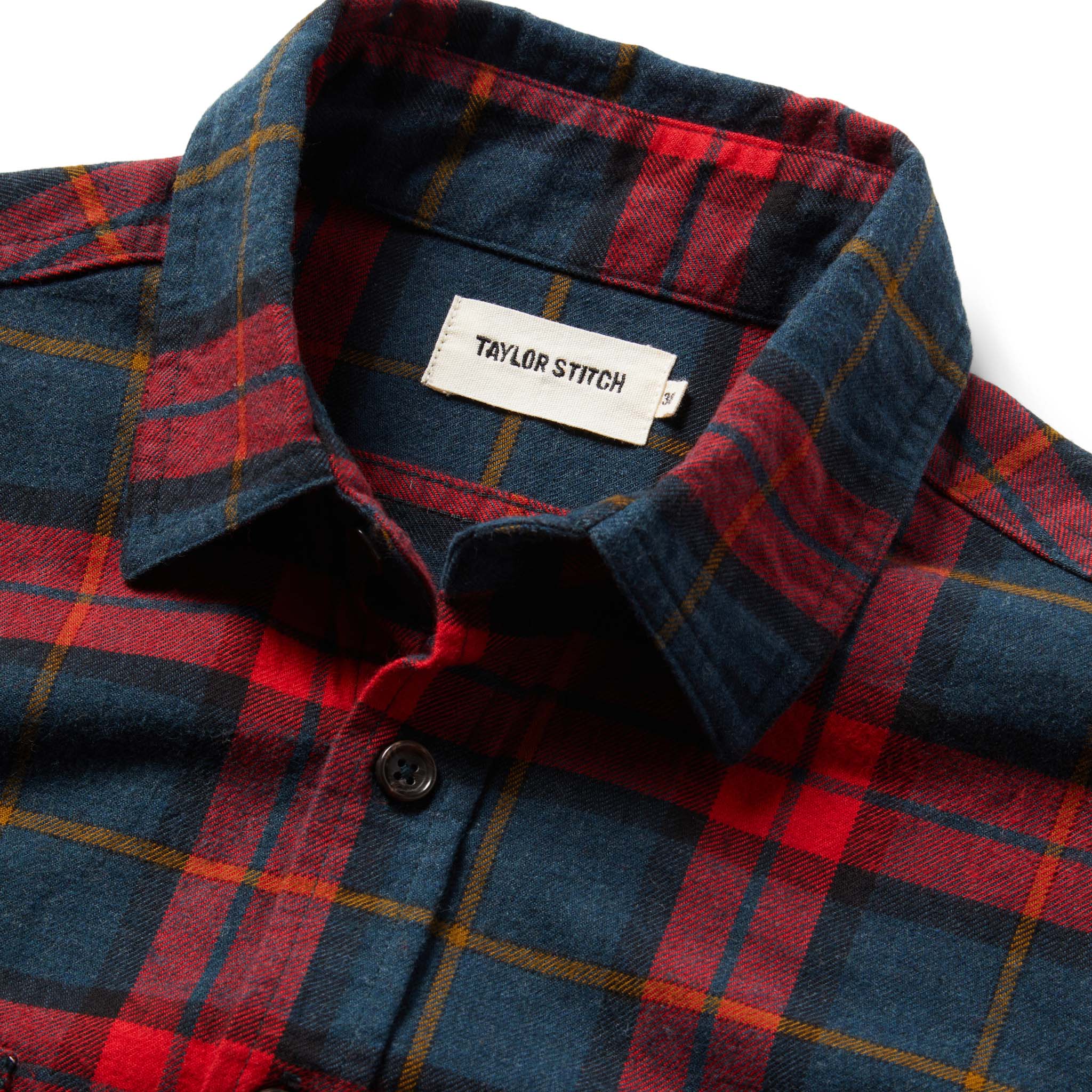 material shot showing interior label of The Utility Shirt in Brushed Red Plaid, Wovens by Taylor Stitch