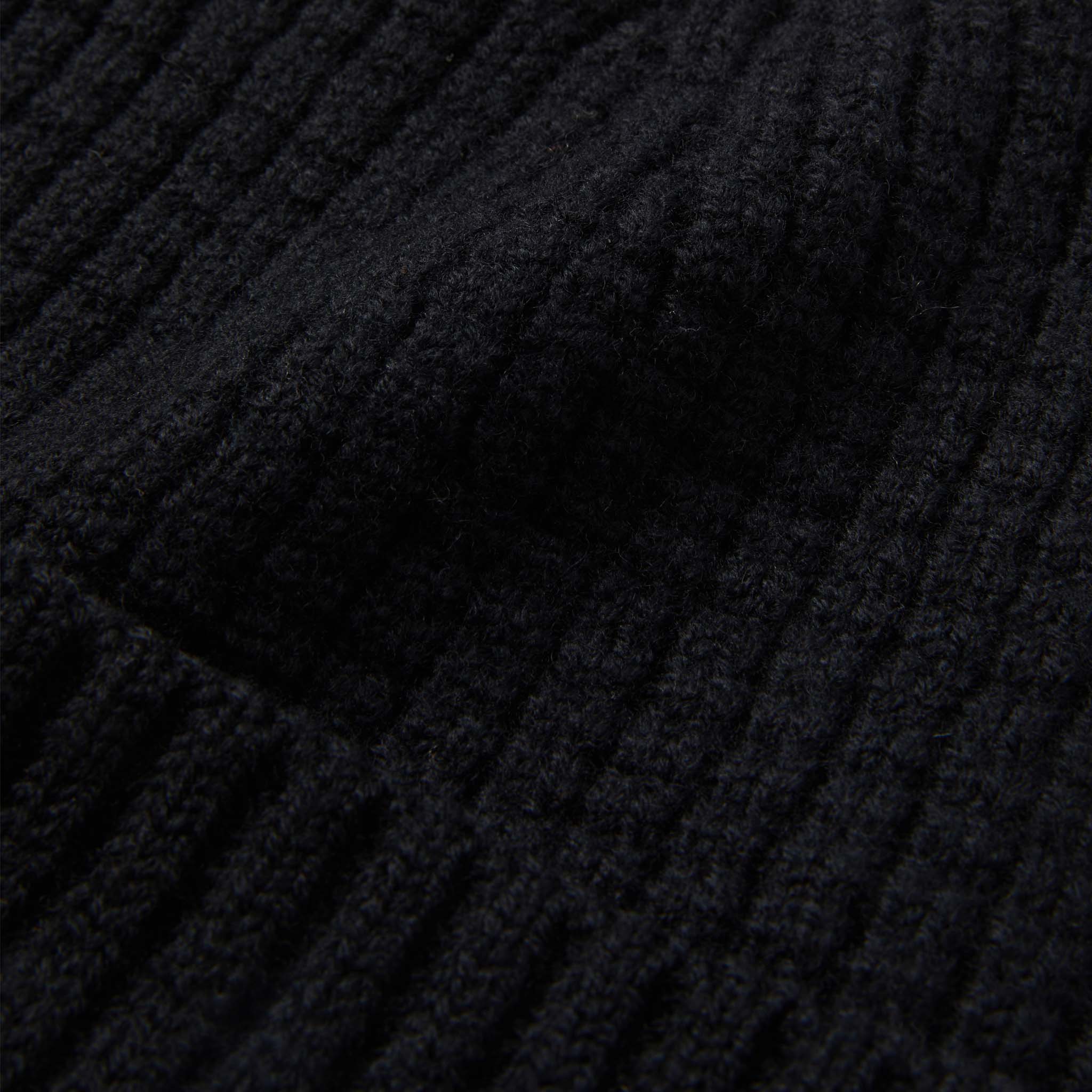 material shot of close up texture of The Waffle Beanie in Coal Merino, Accessories by Taylor Stitch