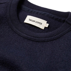 Material shot of The Weekend Crewneck in Navy Boiled Wool showing inner tag