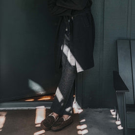 fit model wearing The Weekend Pant in Charcoal Herringbone Wool outside on the porch