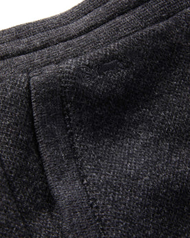 material shot of The Weekend Pant in Charcoal Herringbone Wool showing TS logo embroidery , Bottoms by Taylor Stitch