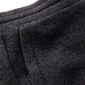 material shot of The Weekend Pant in Charcoal Herringbone Wool showing TS logo embroidery 