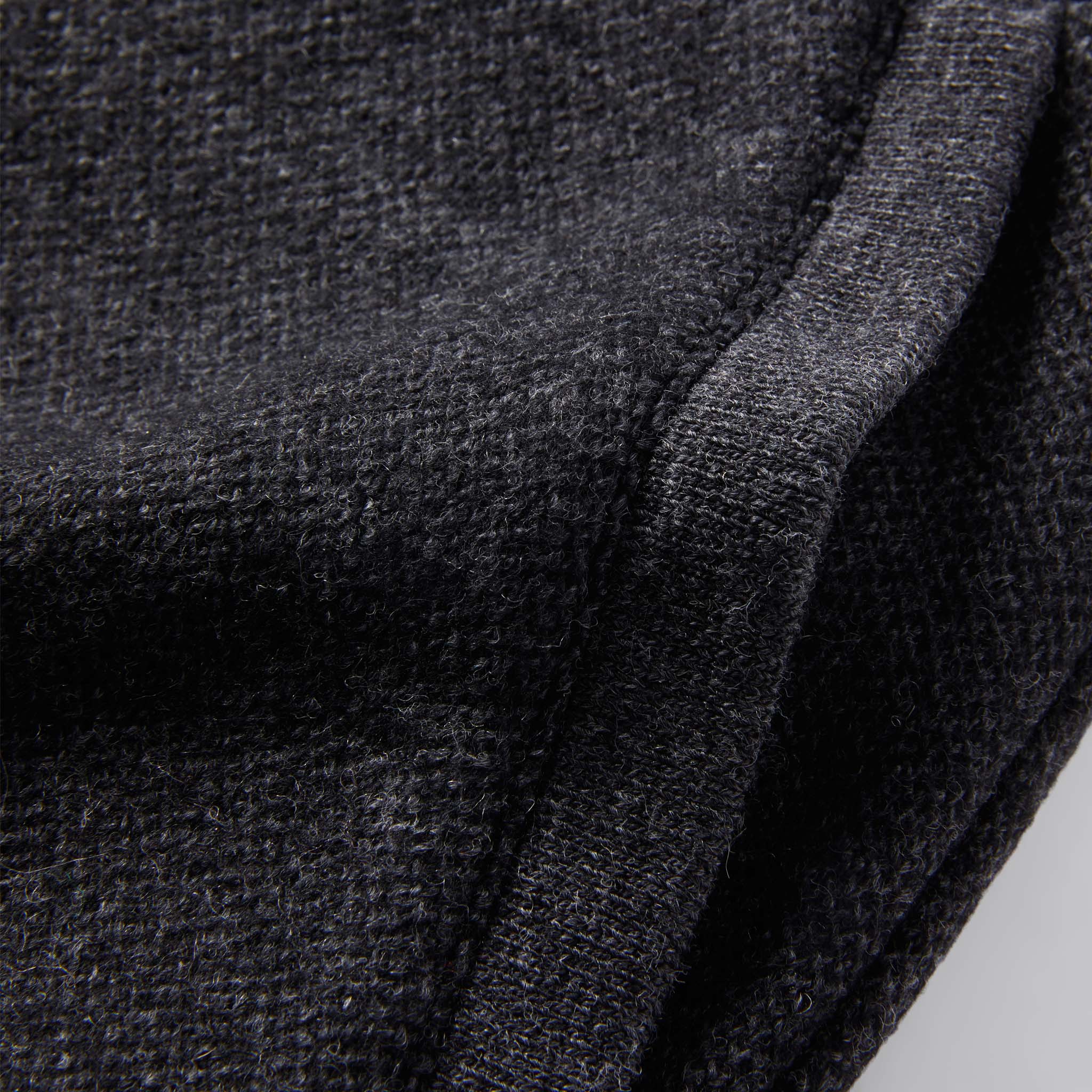 material shot of The Weekend Pant in Charcoal Herringbone Wool showing ribbing at pocket, Bottoms by Taylor Stitch